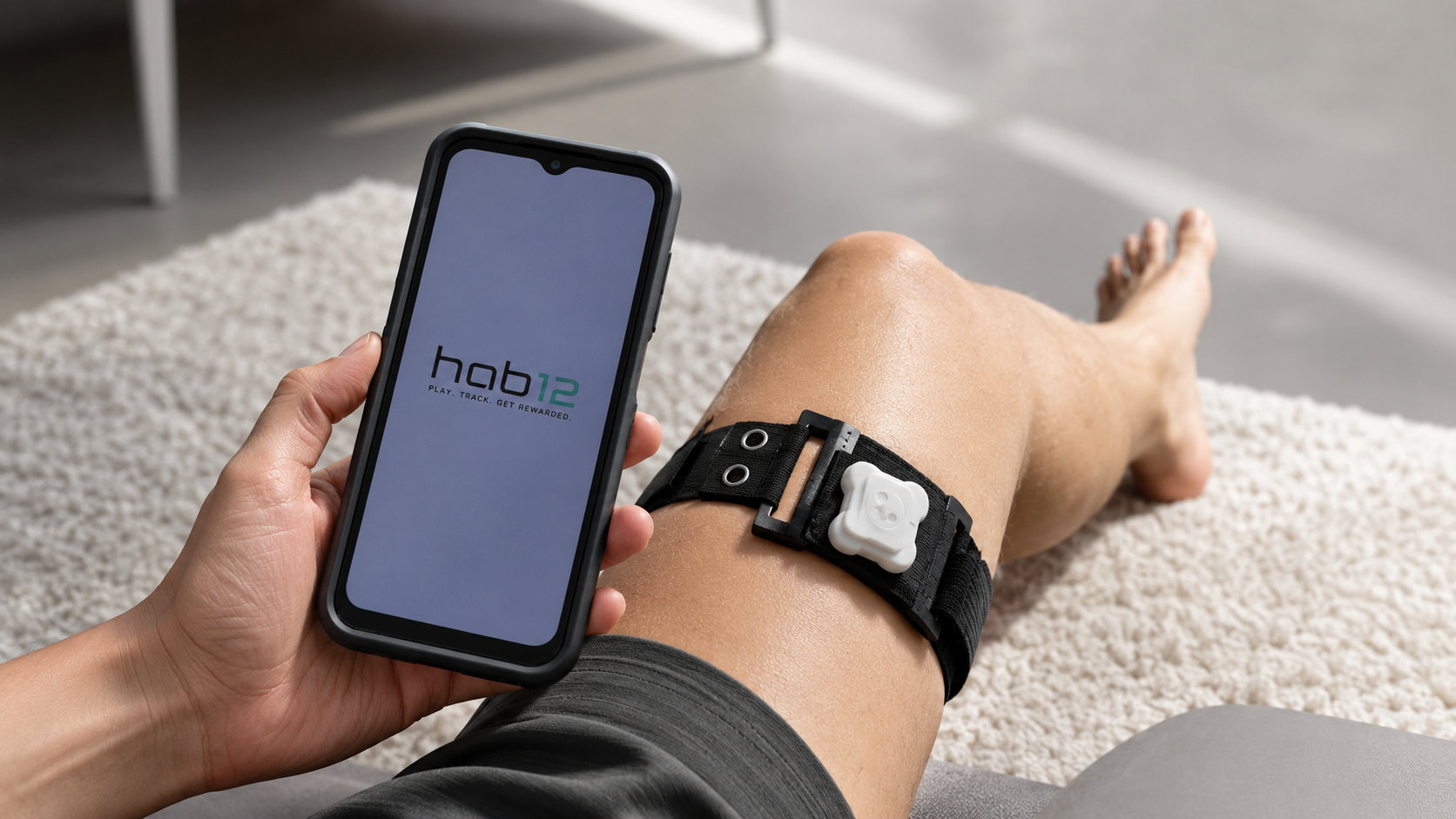 Person using Hab12 with the smartphone app and thigh-mounted wearable sensor